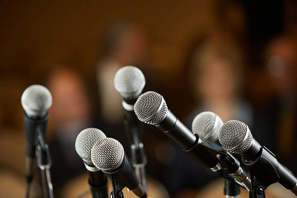 Seven microphones on stands